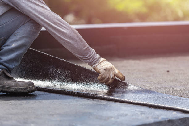 Professional Waterproofing technician working in Weston, MI